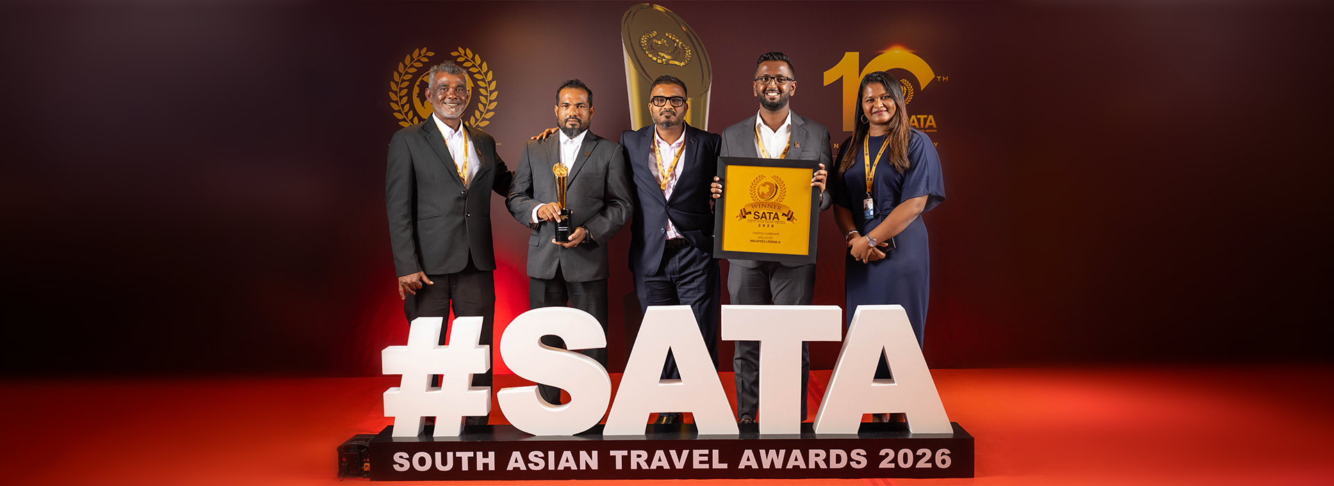 Official SATA 2026 team photo with trophy and certificate